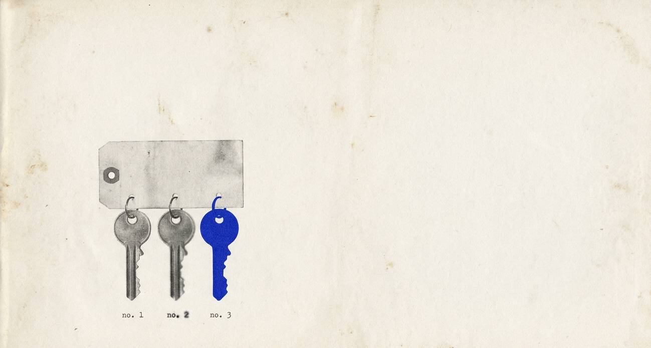 Three keys hanging from a tag, labelled no. 1, no. 2 and no. 3. The third key is bright blue.